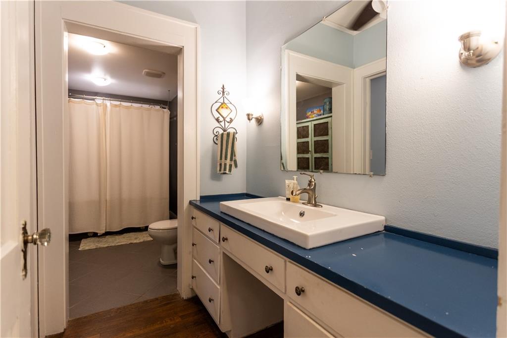 346 North Cherokee Road Social Circle, GA 30025 - Photo 28 of 71 a bathroom with a sink and a mirror