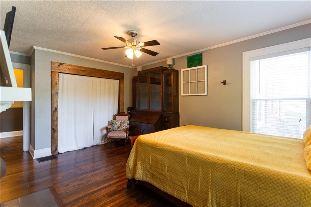 346 North Cherokee Road Social Circle, GA 30025 - Photo 37 of 71 a bedroom with a bed and wooden floor