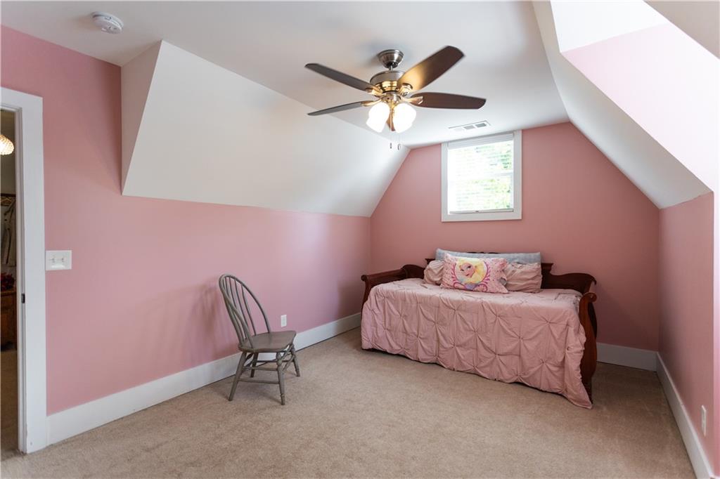 346 North Cherokee Road Social Circle, GA 30025 - Photo 42 of 71 a bedroom with a bed and a chandelier