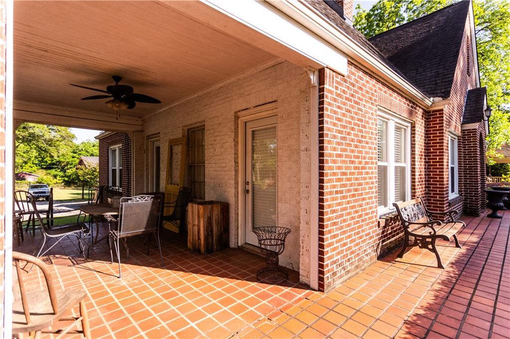 346 North Cherokee Road Social Circle, GA 30025 - Photo 6 of 71 a view of a patio with a dining table and chairs