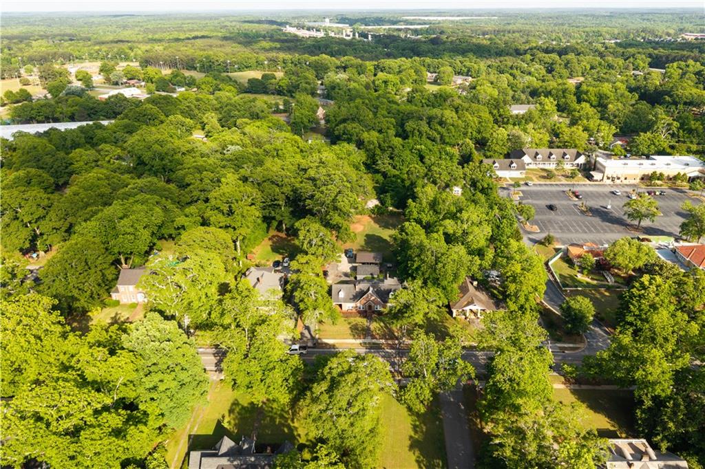 346 North Cherokee Road Social Circle, GA 30025 - Photo 67 of 71 an aerial view of residential houses with outdoor space and trees