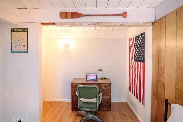 a room with a chair and a wooden floor