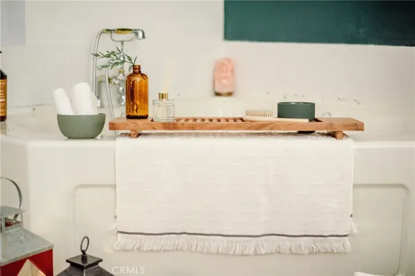 a picture of a bathroom with a sink and a mirror