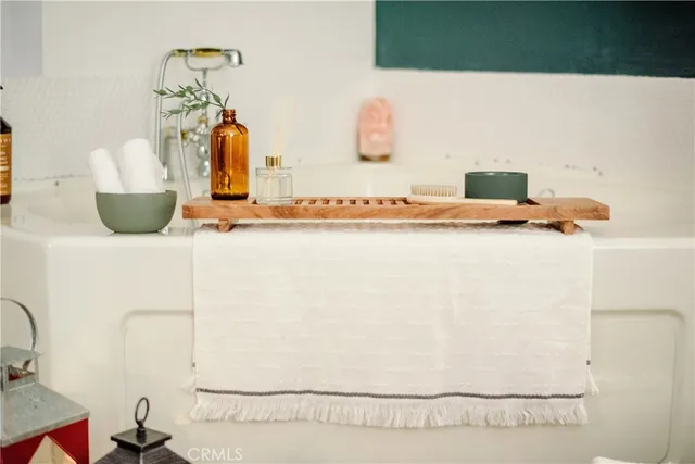 a picture of a bathroom with a sink and a mirror