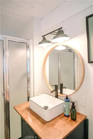 a bathroom with a sink and a mirror