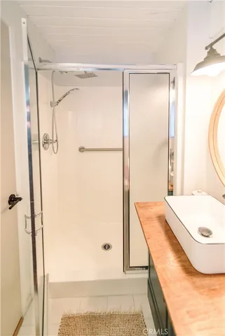 a bathroom with a tub and a shower