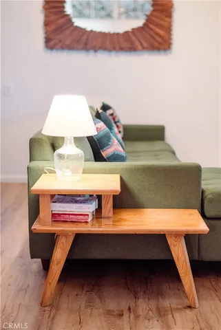 a living room with furniture and a lamp
