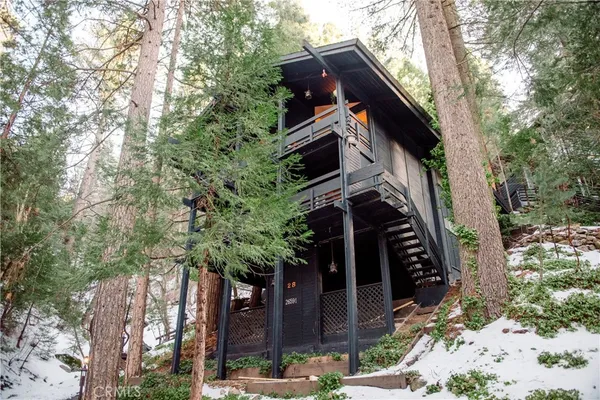 a view of a house with a tree
