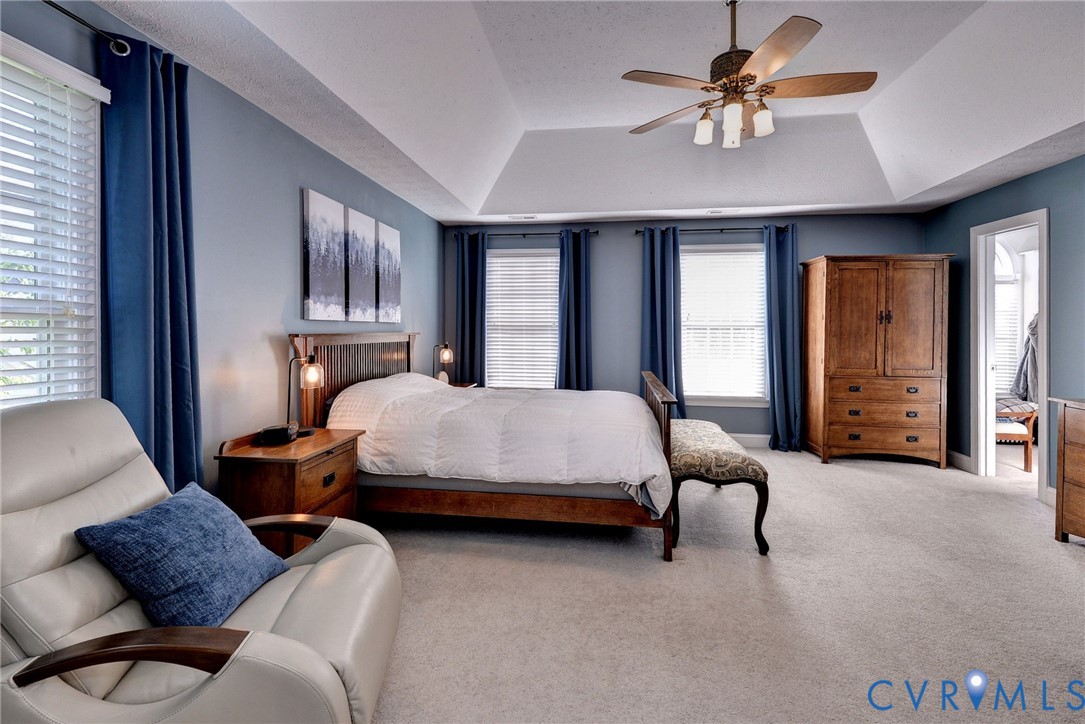 4015 Cold Spring Road Williamsburg, VA 23188 - Photo 25 of 57 Spacious room featuring a tray ceiling with a ceil