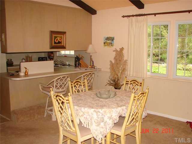2113 Jordan Cabin Road Wendell, NC 27591 - Photo 11 of 20 Dining room and eat-in bar, vaulted ceiling and open beams