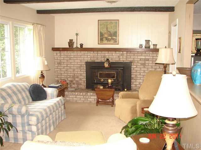 2113 Jordan Cabin Road Wendell, NC 27591 - Photo 8 of 20 Great living room with masonry fireplace and woodstove insert