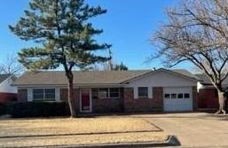 5435 42nd Street Lubbock, TX 79414 - Photo 1 of 12 a front view of a house with a yard