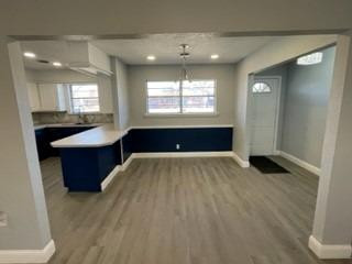 5435 42nd Street Lubbock, TX 79414 - Photo 2 of 12 a room with a large bed and a chandelier