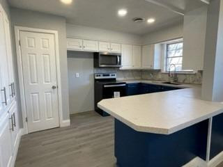 5435 42nd Street Lubbock, TX 79414 - Photo 3 of 12 a kitchen with a sink a stove and refrigerator