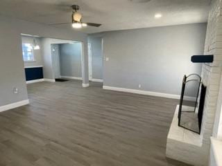 5435 42nd Street Lubbock, TX 79414 - Photo 5 of 12 wooden floor in an empty room with a mirror