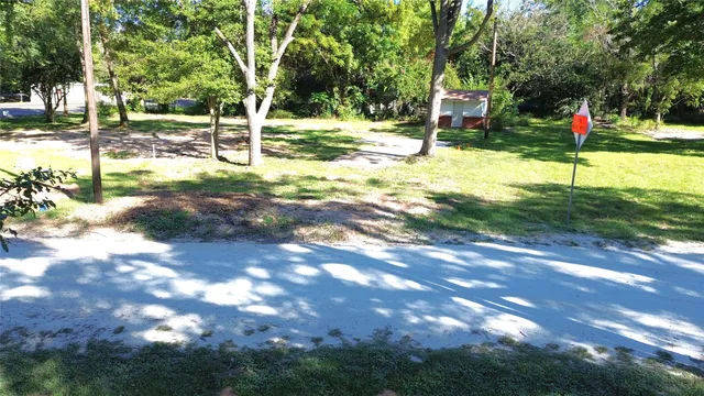 a view of a yard with swimming pool