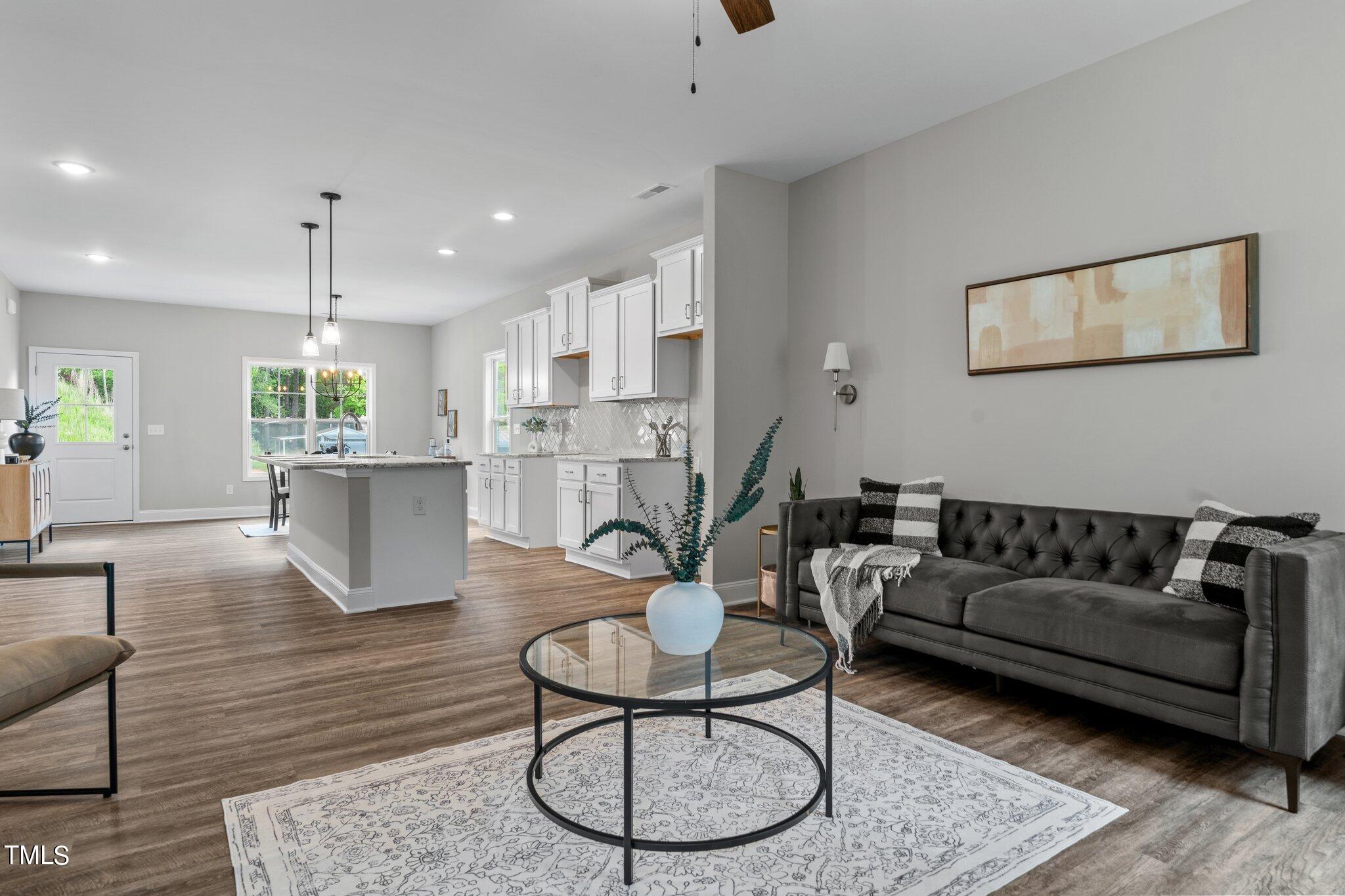 57 Regis Lane Coats, NC 27521 - Photo 11 of 39 a living room with furniture kitchen and a table