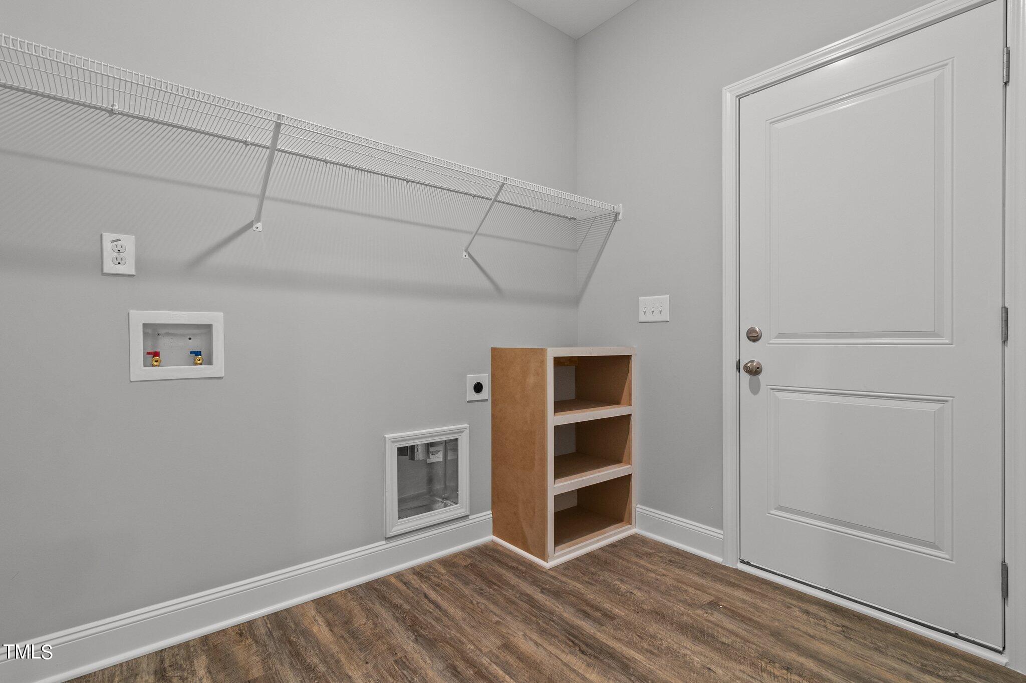 57 Regis Lane Coats, NC 27521 - Photo 17 of 39 a view of empty room with wooden floor and cabinet