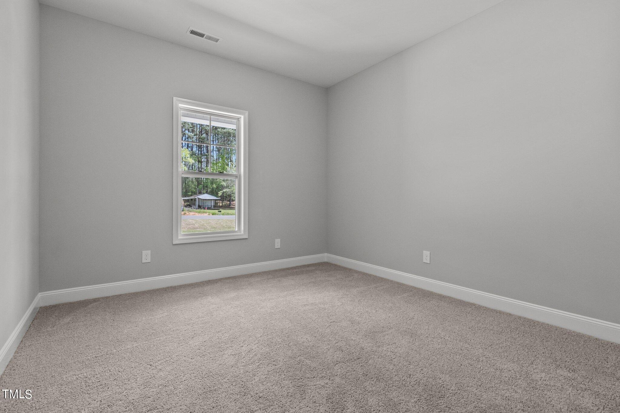 57 Regis Lane Coats, NC 27521 - Photo 19 of 39 an empty room with a window