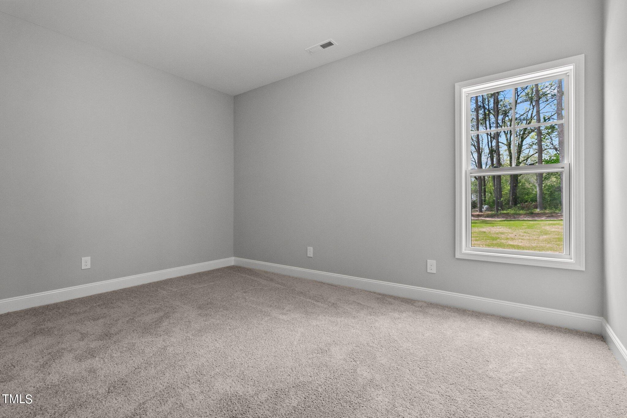 57 Regis Lane Coats, NC 27521 - Photo 21 of 39 an empty room with a window