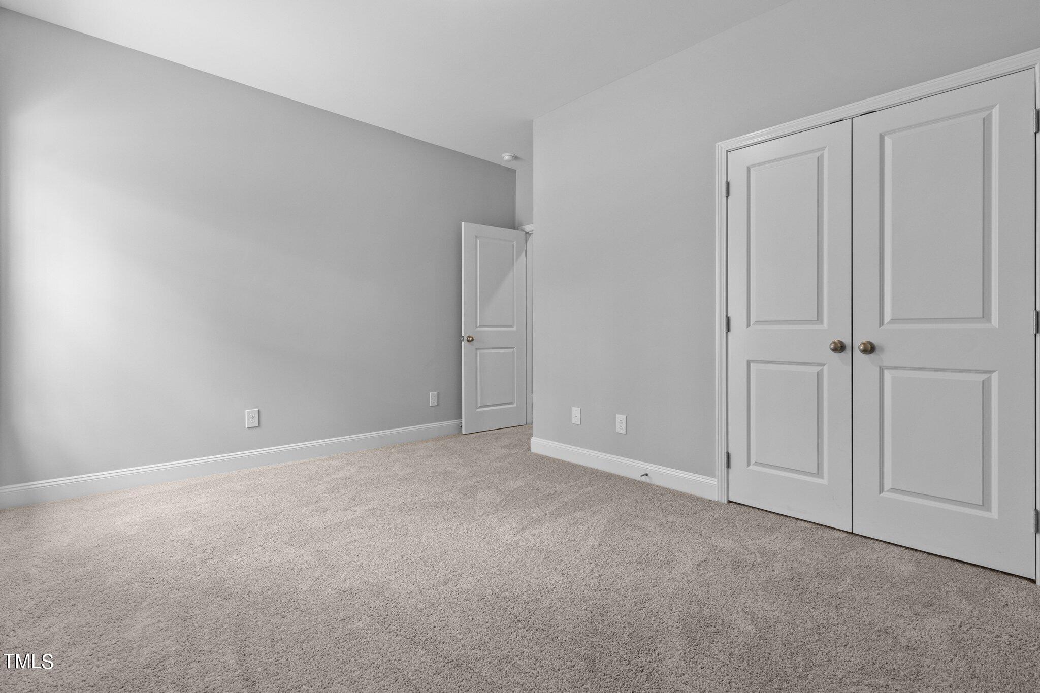 57 Regis Lane Coats, NC 27521 - Photo 22 of 39 a view of an empty room and closet area