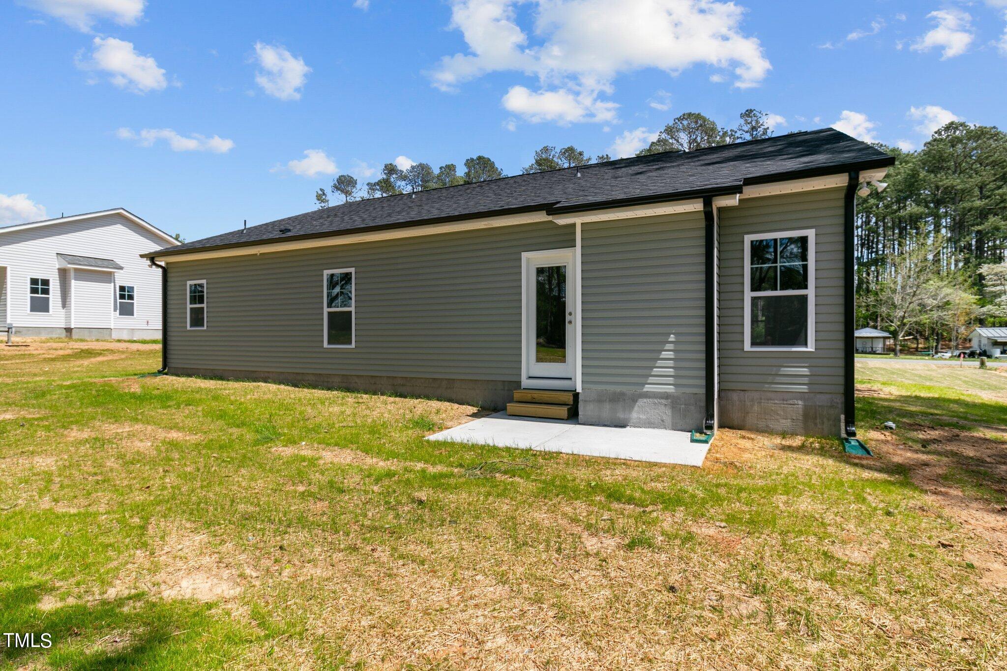 57 Regis Lane Coats, NC 27521 - Photo 31 of 39 a view of a backyard of the house