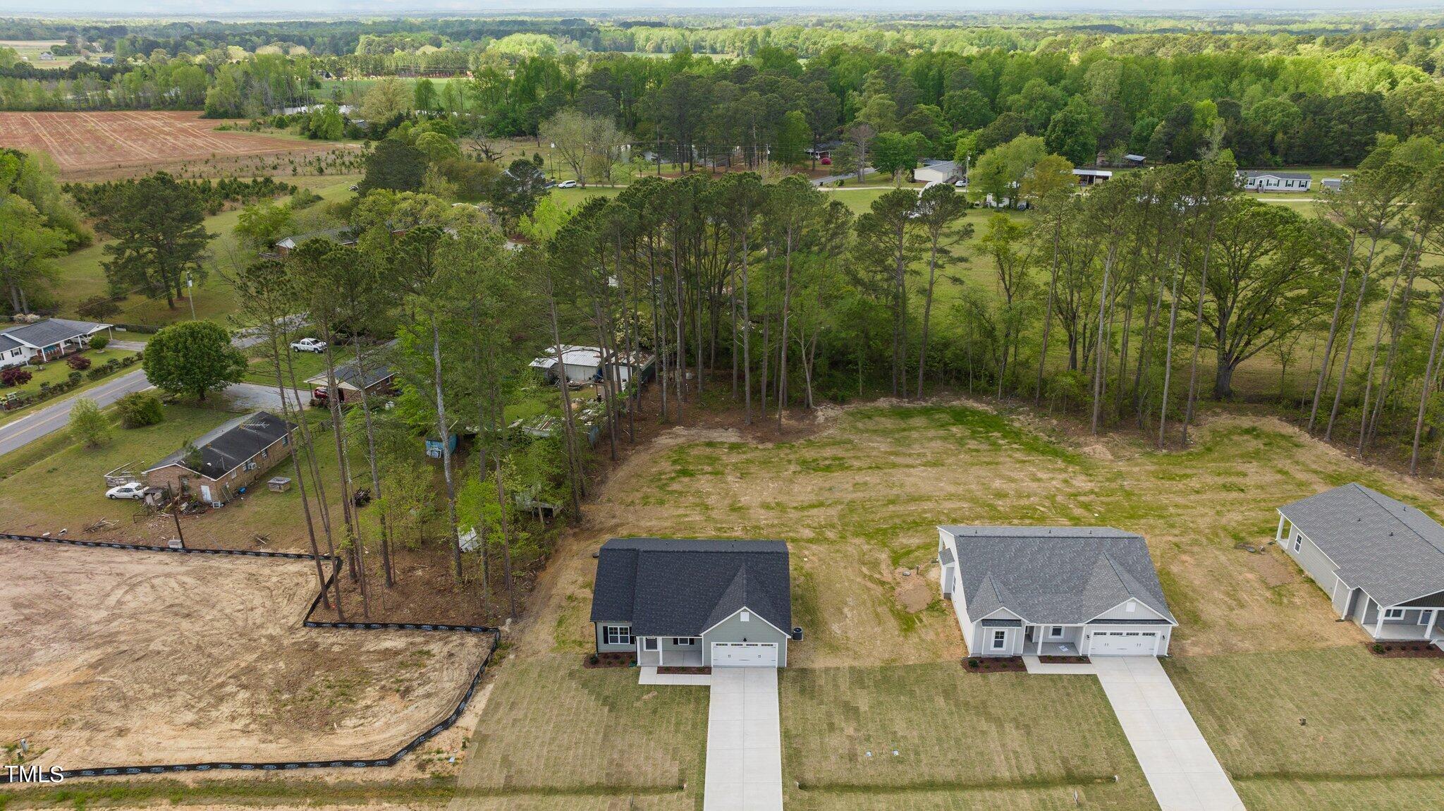 57 Regis Lane Coats, NC 27521 - Photo 34 of 39 a view of a lake with houses