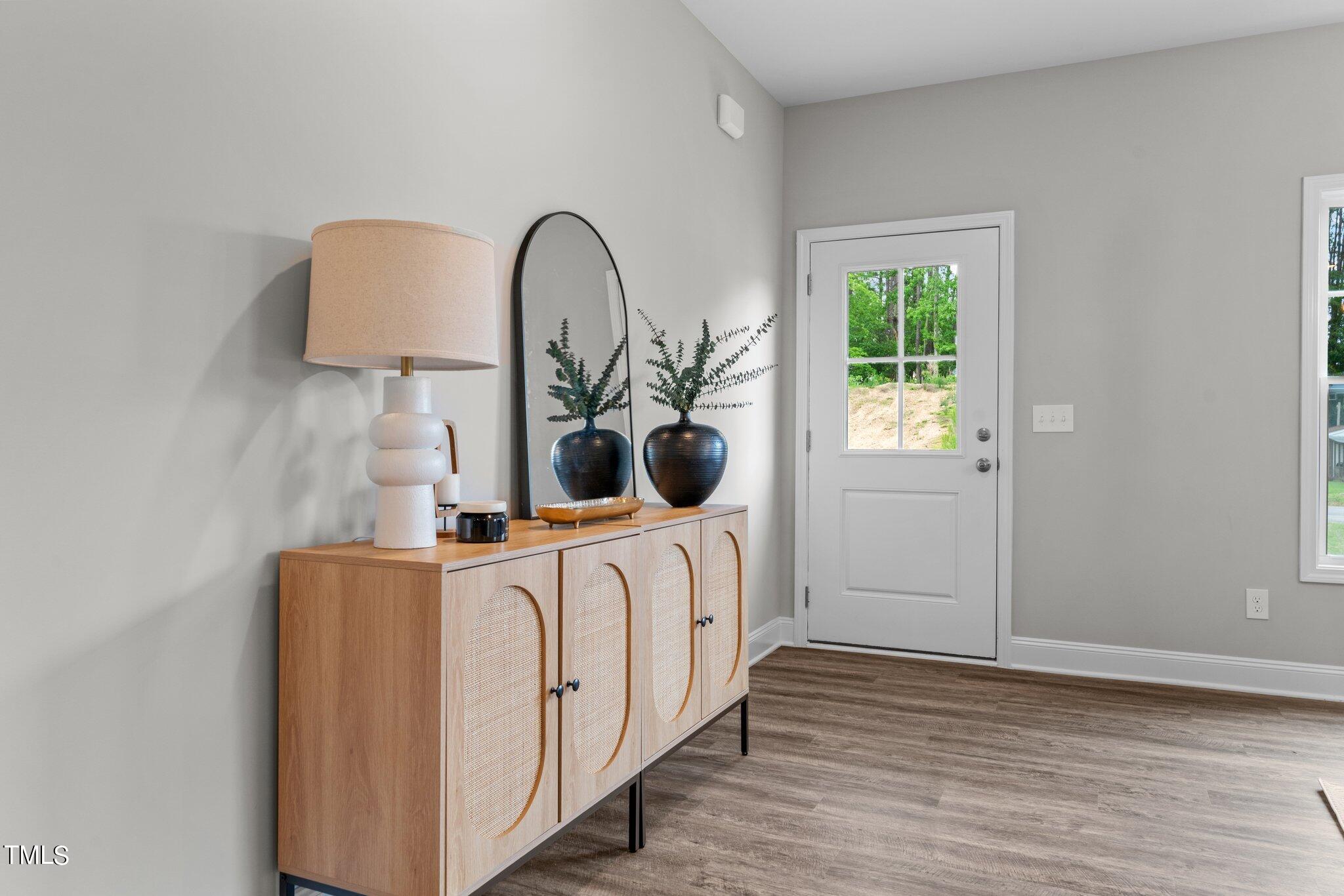 57 Regis Lane Coats, NC 27521 - Photo 8 of 39 a view of living room with furniture and wooden floor