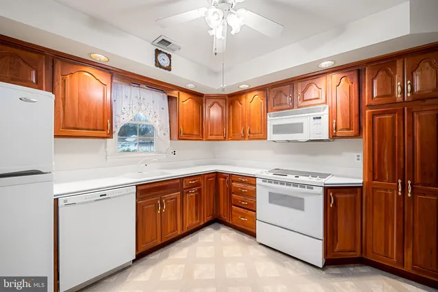 a kitchen with stainless steel appliances granite countertop a stove cabinets and a sink