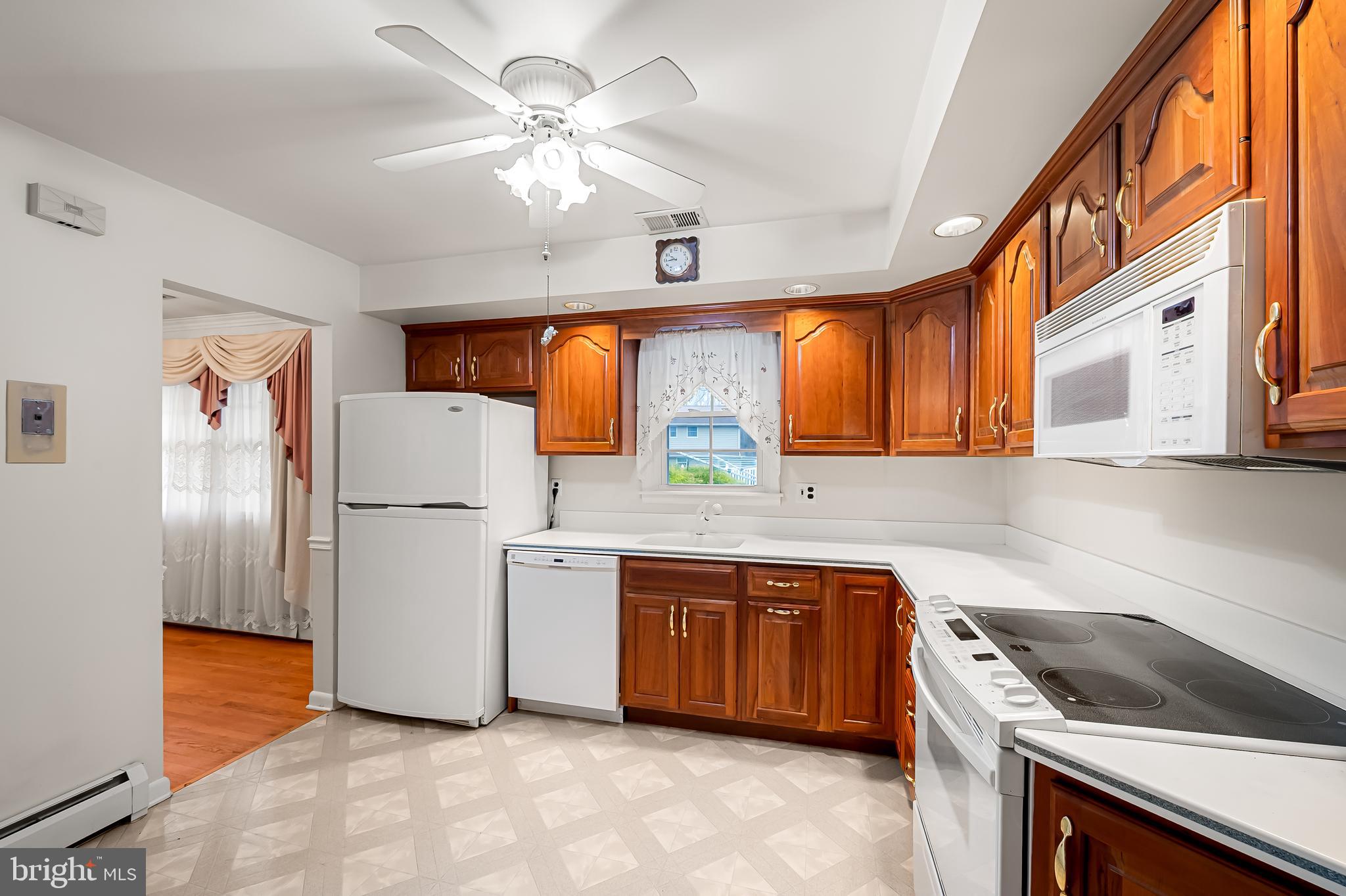 2114 Oaklyn Drive Fallston, MD 21047 - Photo 12 of 41 a kitchen that has a sink stainless steel appliances a counter space and a window