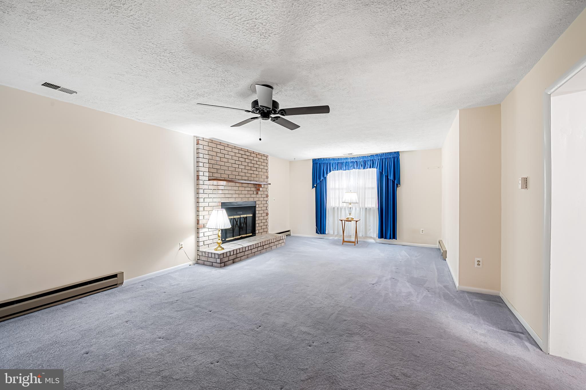 2114 Oaklyn Drive Fallston, MD 21047 - Photo 14 of 41 a view of an empty room with a fireplace and a window