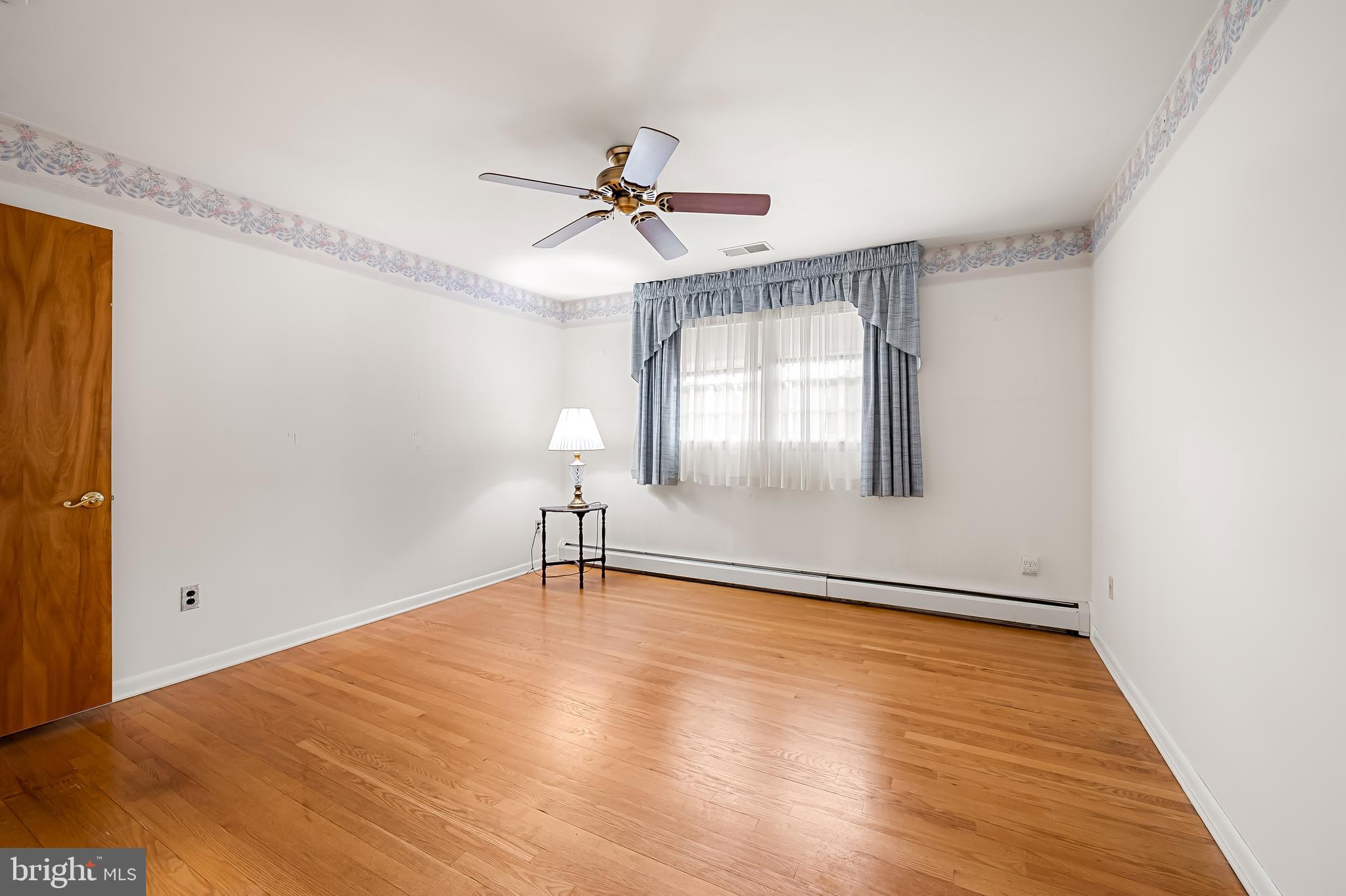2114 Oaklyn Drive Fallston, MD 21047 - Photo 23 of 41 a view of an empty room with window and wooden floor