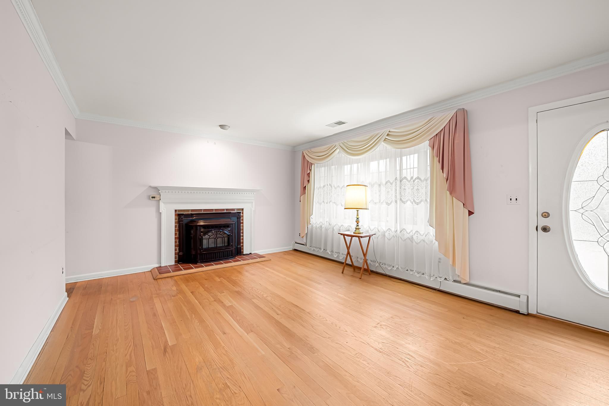 2114 Oaklyn Drive Fallston, MD 21047 - Photo 4 of 41 a view of an empty room with a fireplace and a window