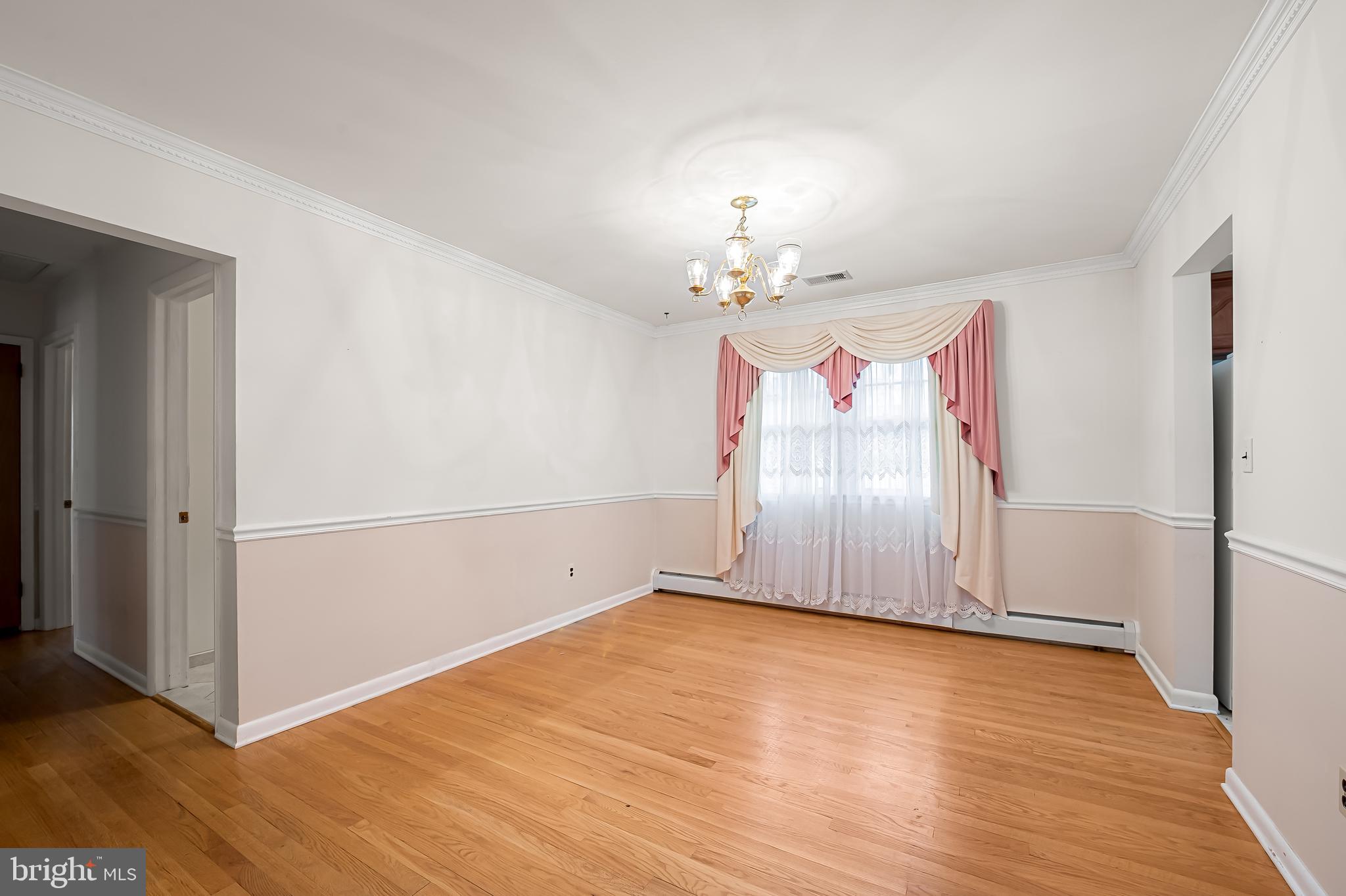 2114 Oaklyn Drive Fallston, MD 21047 - Photo 7 of 41 an empty room with wooden floor and chandelier