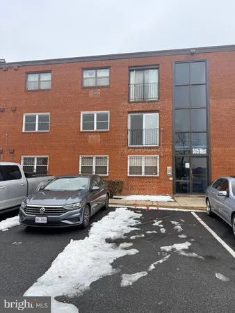 a view of a car parked in front of a building