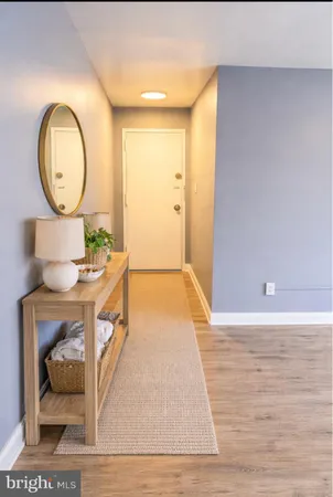 a view of living room and wooden floor