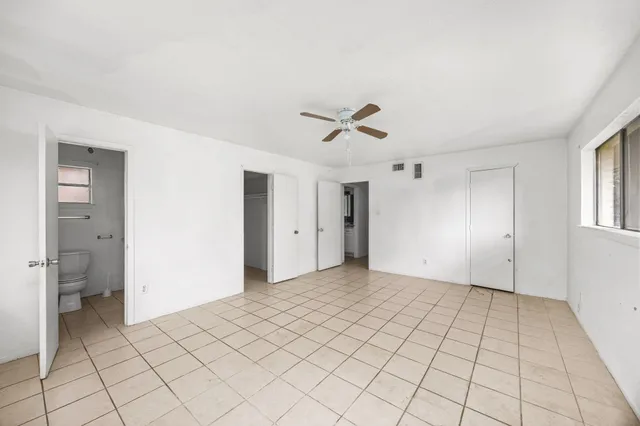 a view of an empty room with windows