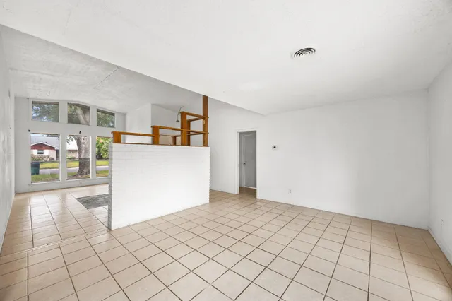 a view of a kitchen with kitchen appliances and cabinets