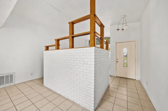 a view of storage and utility room with a fireplace
