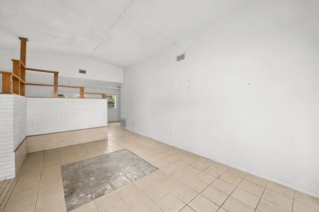a kitchen with a sink a stove and cabinets