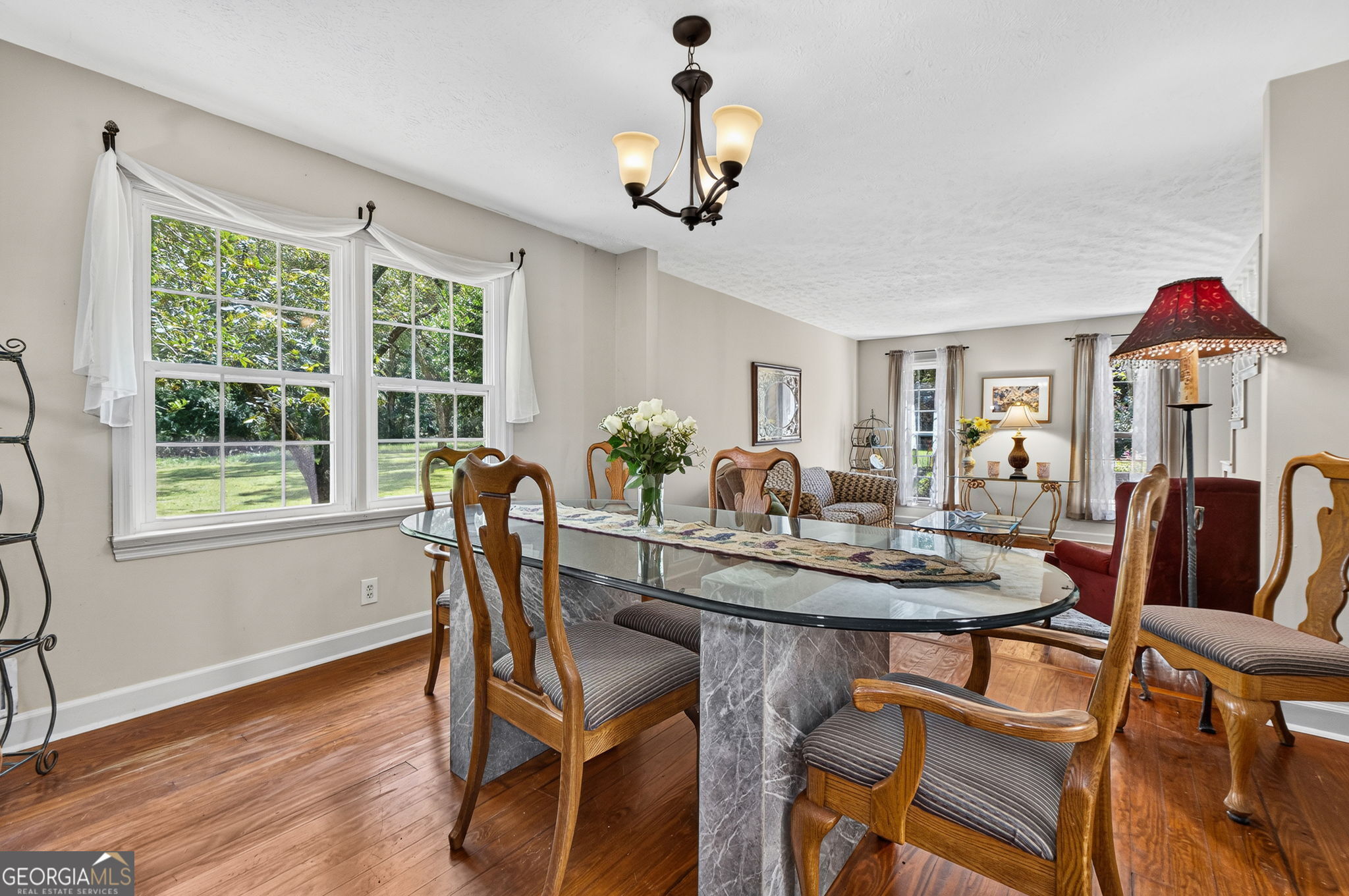 169 Silver Dollar Road Barnesville, GA 30204 - Photo 15 of 66 Large dining area wood flooring step down into living room