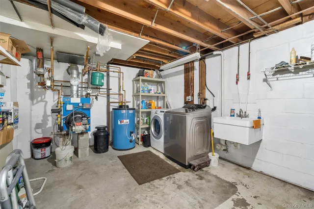 a view of a storage room with water heater and racks