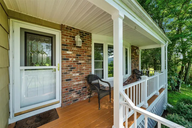 a view of a balcony with chairs