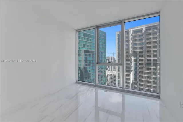 a bathroom with a sink shower and a mirror