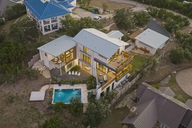 an aerial view of residential houses with outdoor space