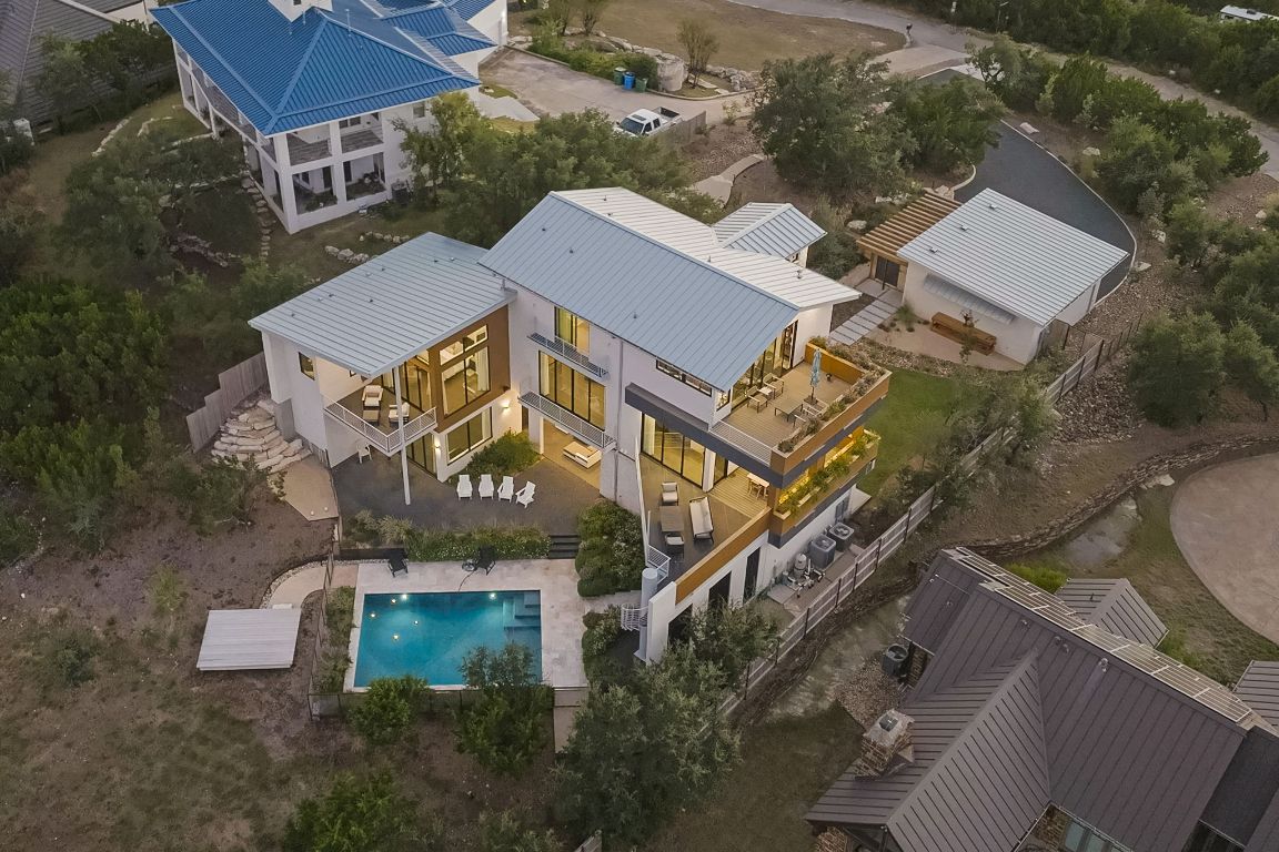an aerial view of residential houses with outdoor space