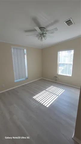 a view of an empty room with windows