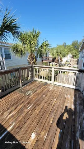a view of balcony with wooden floor and outdoor space