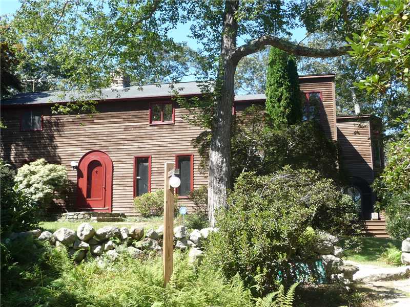 Exterior Front. Clapboard exterior of nautically inspired home offering privacy on over 6 acres of beautiful proerty.