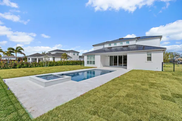 a view of pool with yard